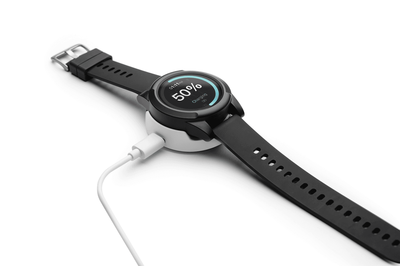 Indy Smartwatch worn on a senior man's wrist while he reads in a comfortable armchair, close-up showing the modern watch face - view 5